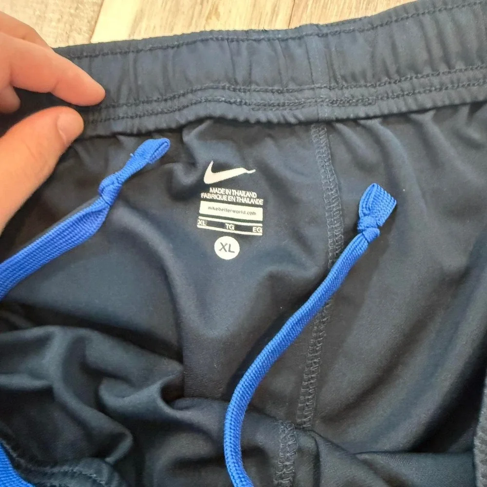 2000s baggy Nike black track pants with blue stripe sz XL